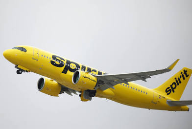 Spirit Airlines yellow airplane in flight